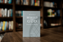 The Sermons of Behold Your God: Rethinking God Biblically by Dr. John Snyder with bookcase in the background